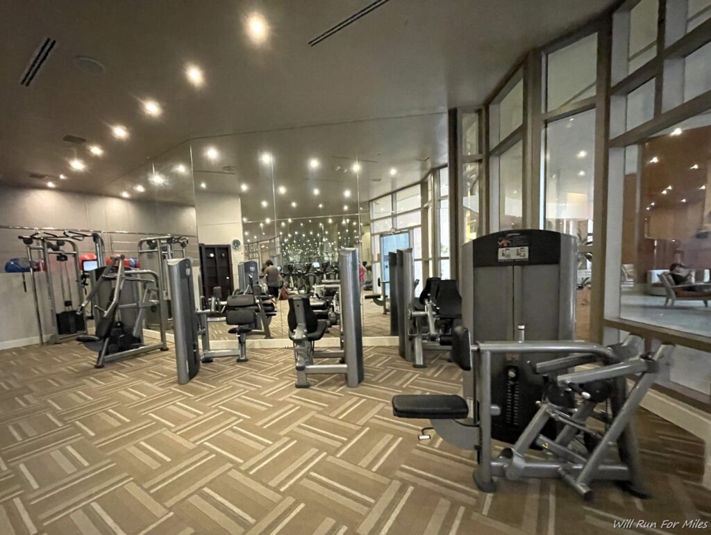 a gym with many exercise equipment