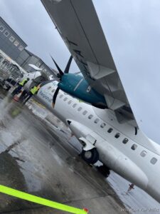 a plane with a propeller on the wing