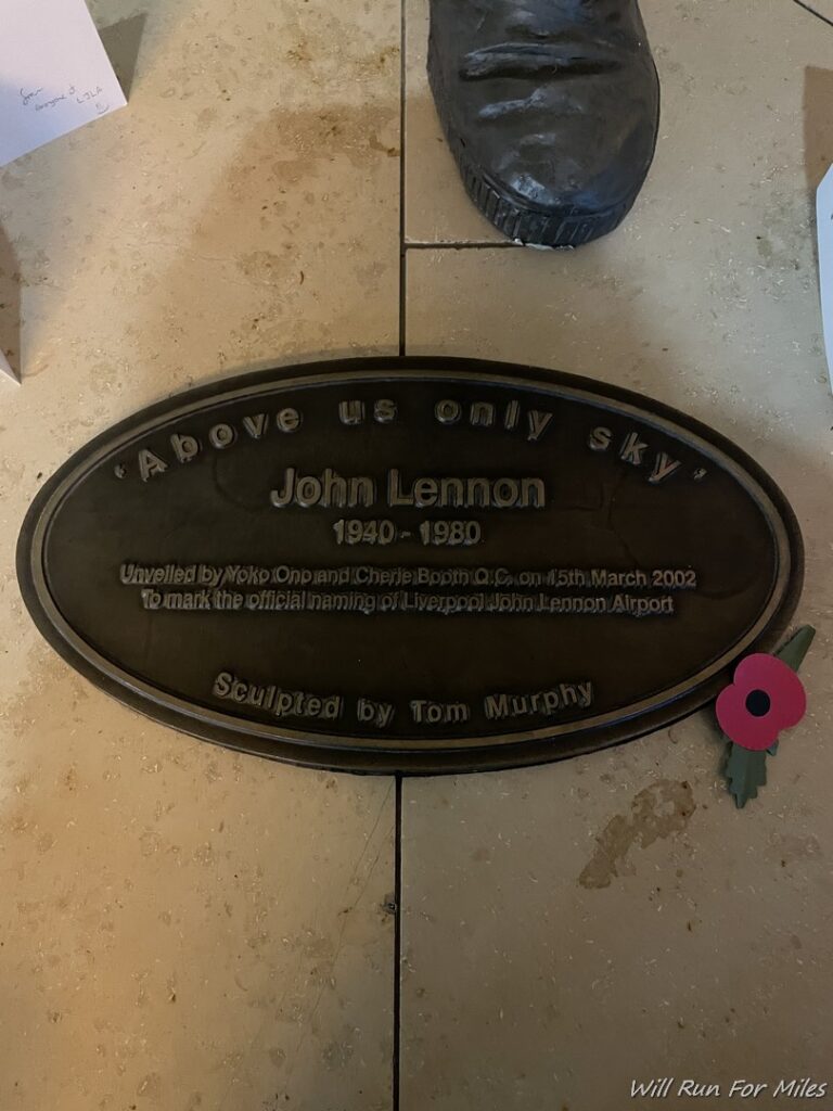 a plaque on a tile floor