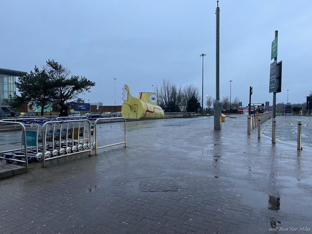 a yellow submarine in a parking lot
