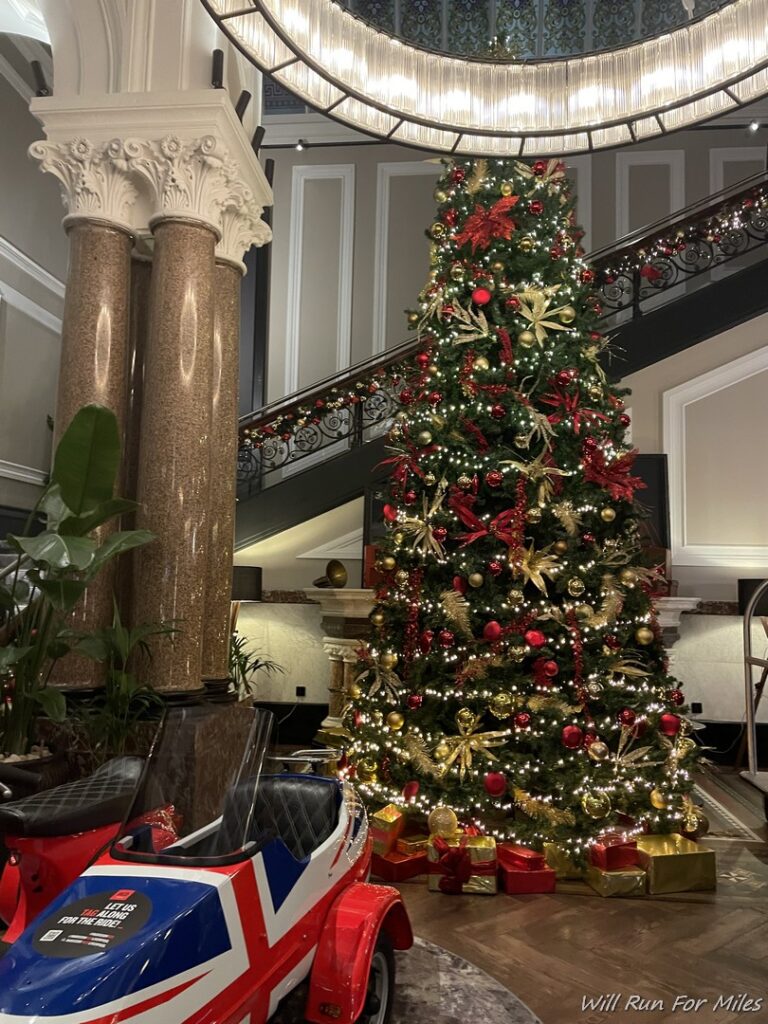 a christmas tree with lights and presents