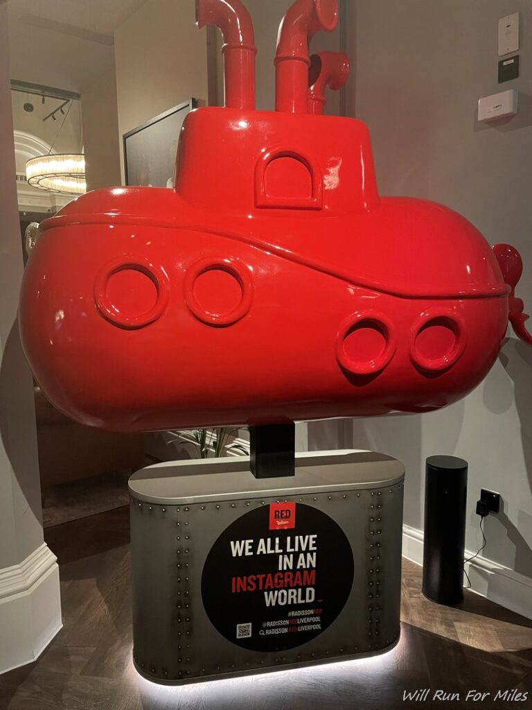 a red submarine statue in a room