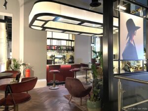 a room with a bar and chairs