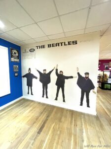 a wall with a picture of a group of men