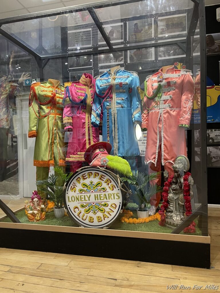 a display case with colorful clothing