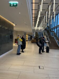 a group of people standing in a lobby