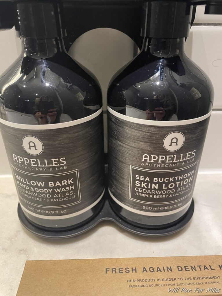 two black bottles of body lotion