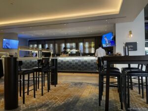 a bar with a counter and chairs