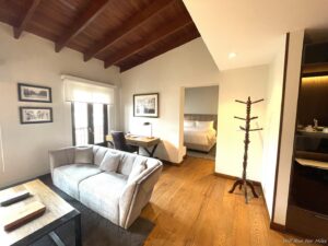 a room with a couch and a wood floor