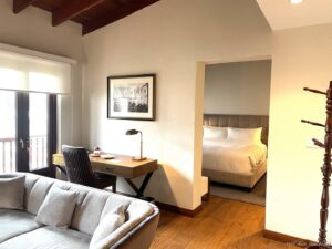 a room with a bed and a desk