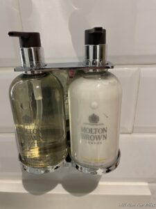 a soap dispenser on a wall