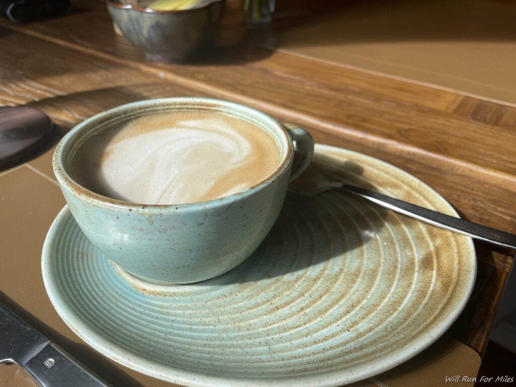 a cup of coffee on a plate