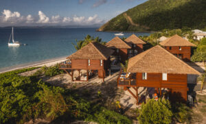 a group of houses on a beach