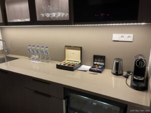 a counter with a box of cigarettes and water bottles