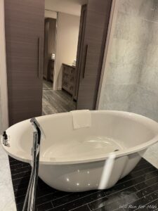 a white bathtub in a bathroom