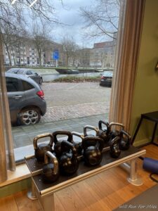 a group of kettlebells on a bench