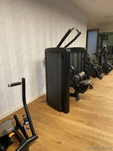 a group of exercise machines in a room