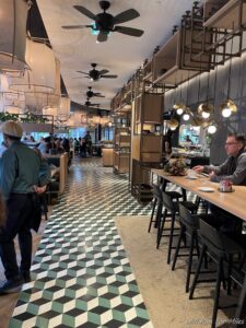 a group of people sitting at a table in a restaurant
