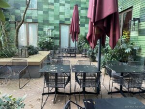 a patio with tables and chairs