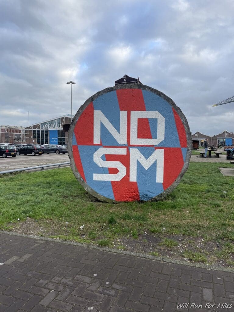 a large circular sign on grass