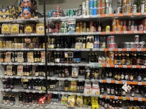 a shelves with different types of beverages