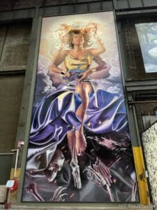 a painting of a woman on a wall