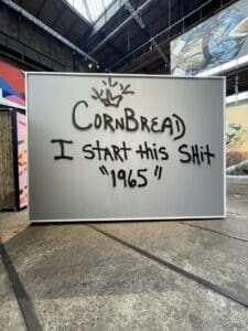 a sign with graffiti on it