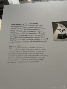 a white board with text and a picture of a street