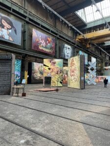 a large room with paintings on the walls