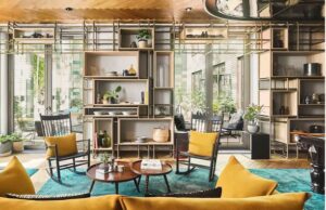 a room with a couch and chairs