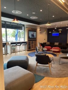 a room with a television and chairs