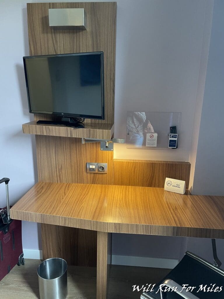 a desk with a tv on it