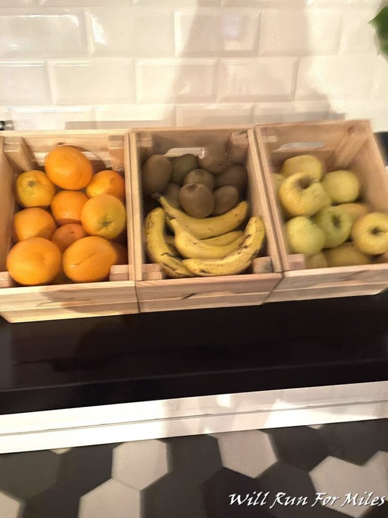 a group of fruit in wooden crates