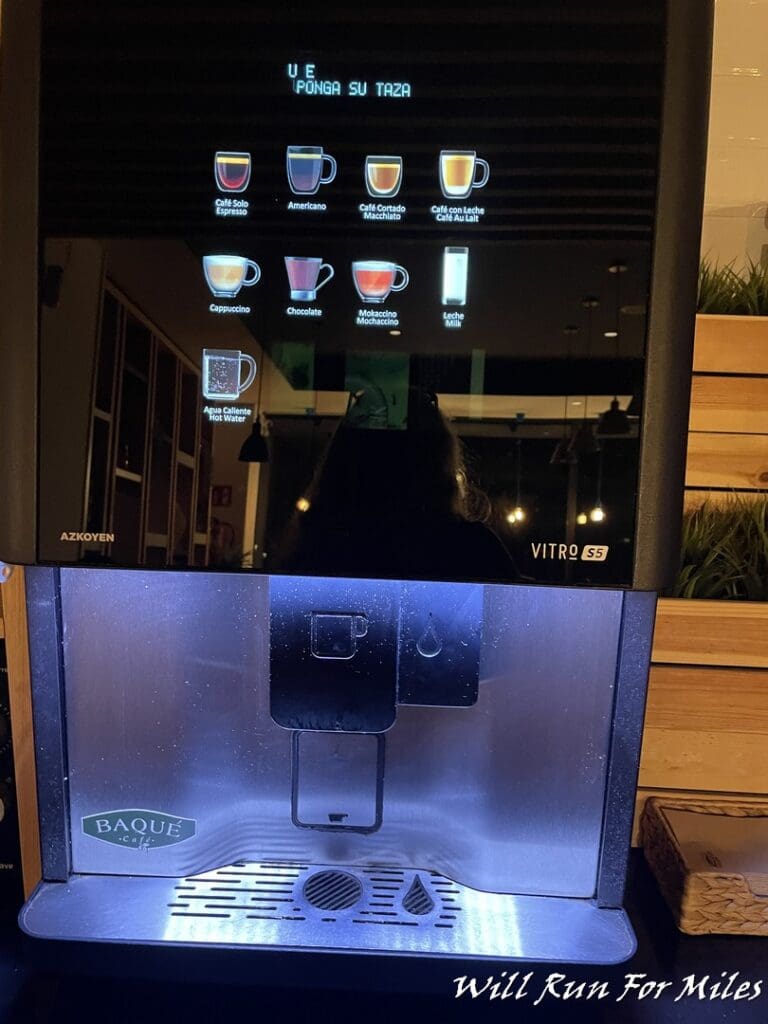 a machine with a screen and a few cups on it