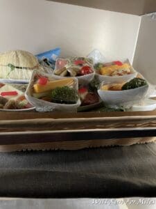 a basket of food in plastic wrap