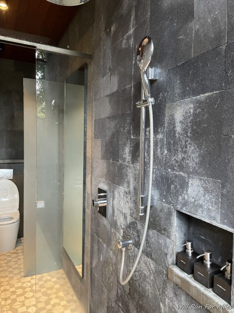 a shower head and shower head in a bathroom