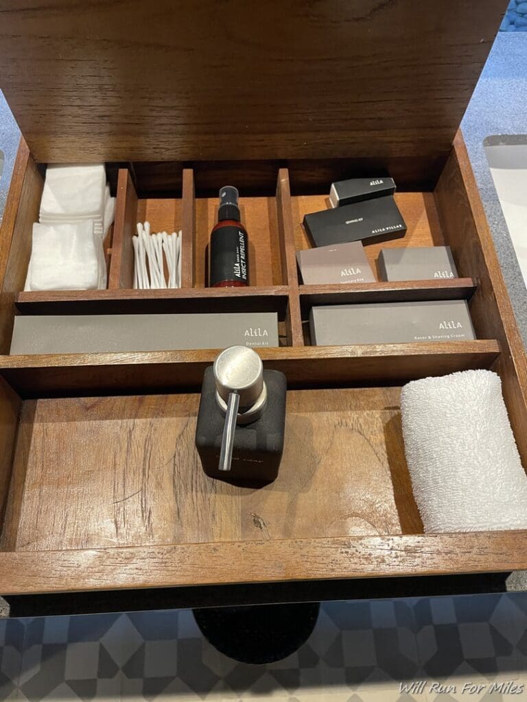 a wooden box with a variety of items inside