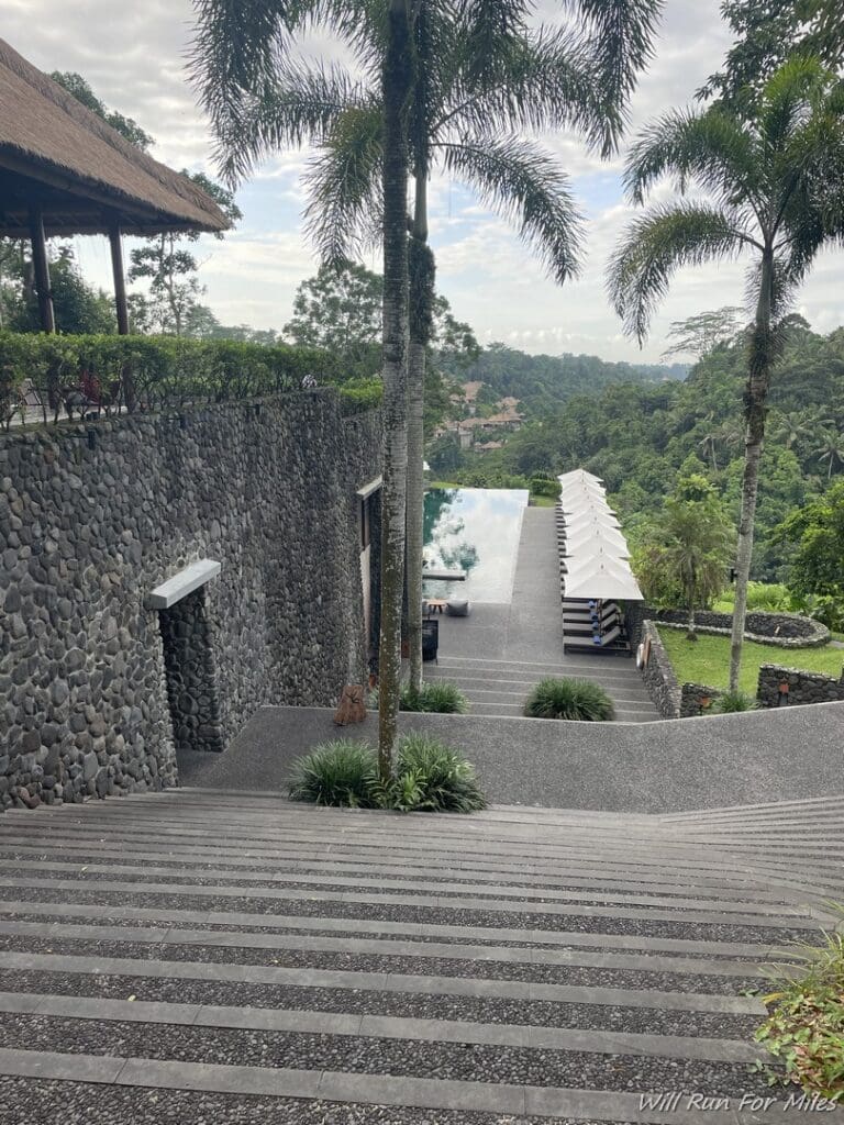 a stone stairs leading to a pool