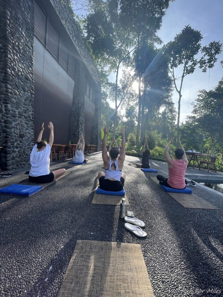 a group of people doing yoga outside