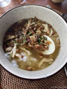 a bowl of soup with food in it