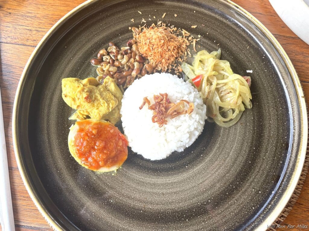 a plate of food on a wood table