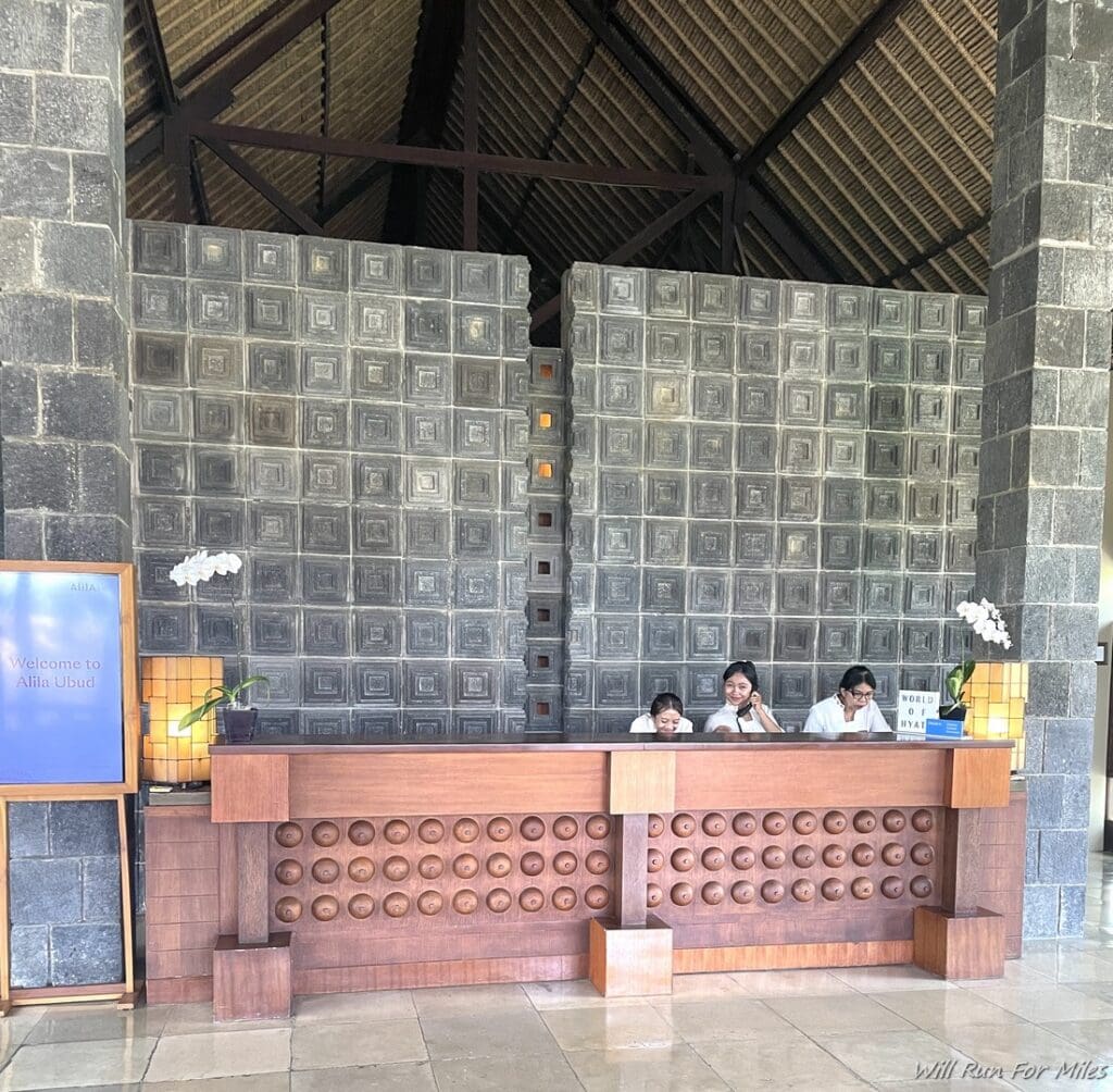 a group of people sitting at a reception desk