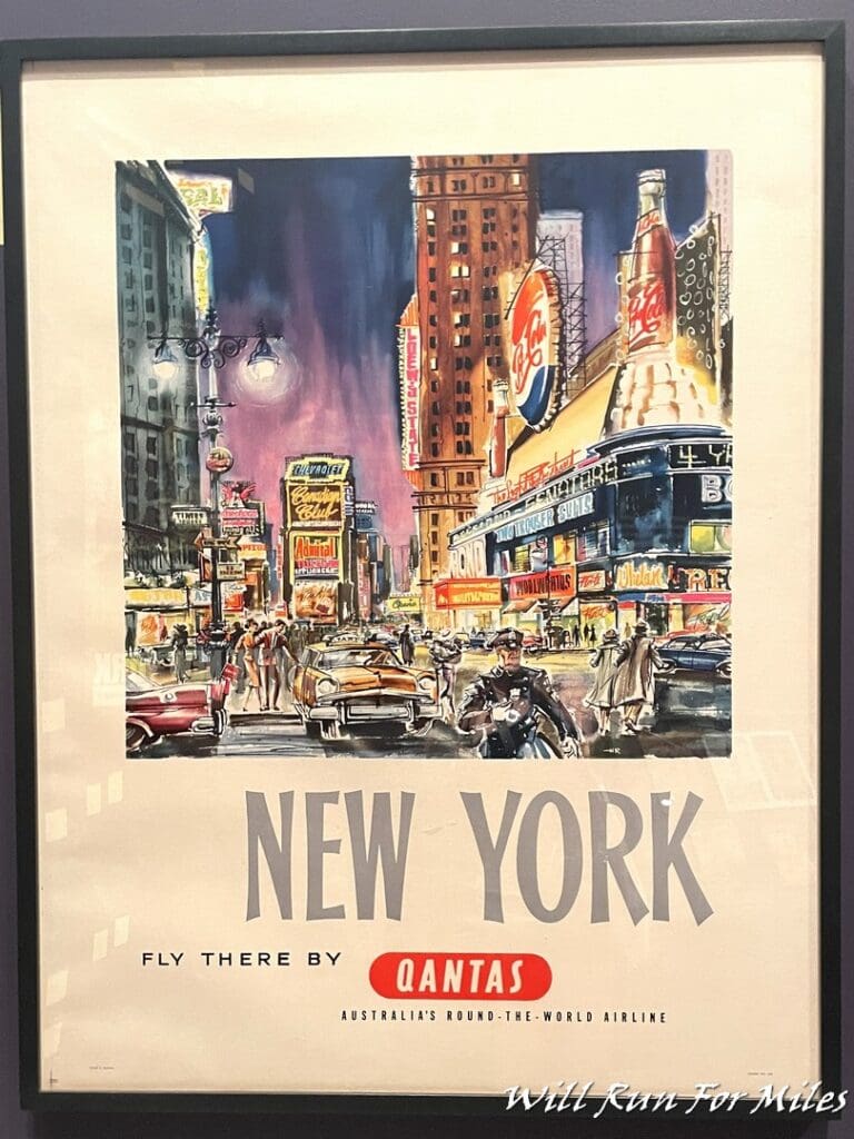 a framed poster of a city