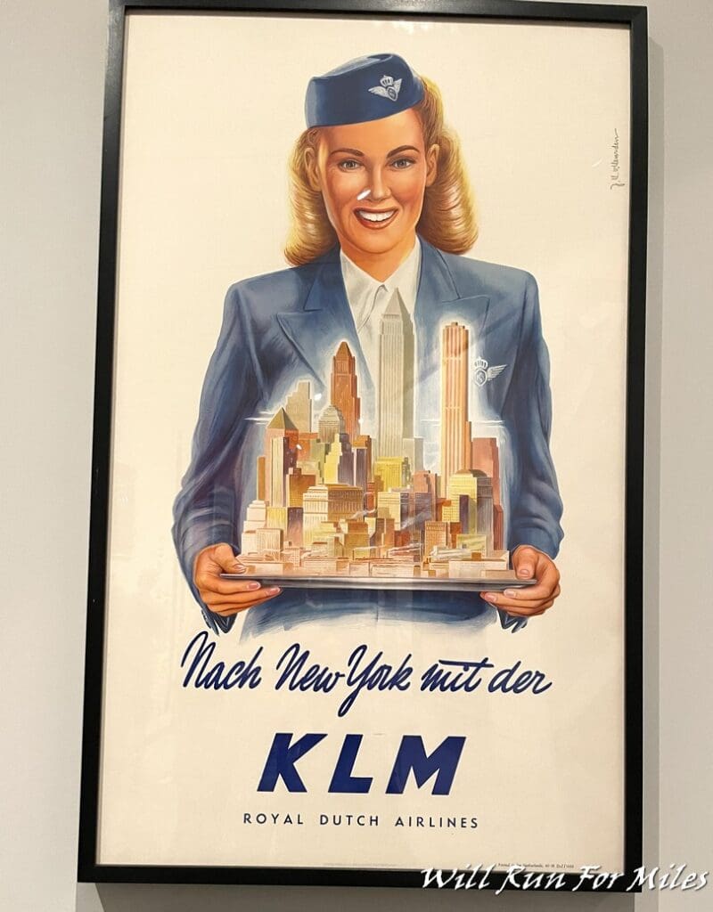 a poster of a woman holding a tray of buildings