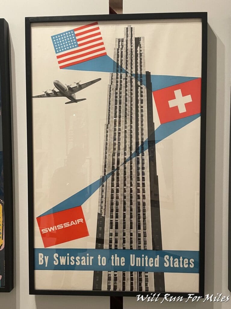 a framed picture of a tall building and flag