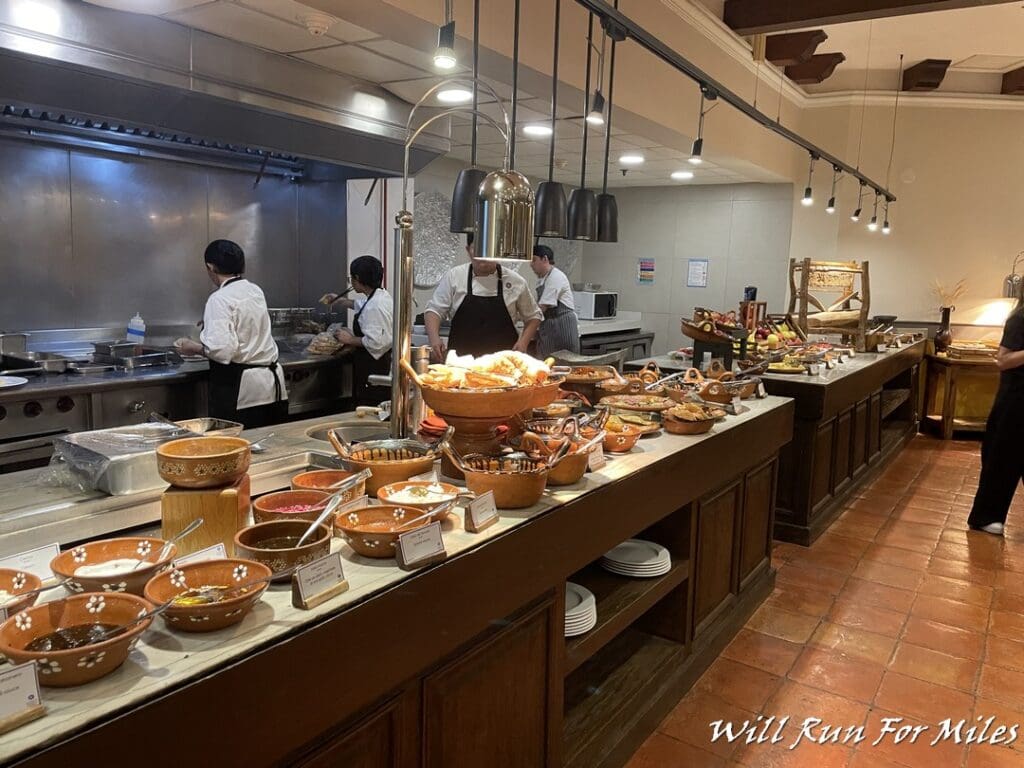 a group of people cooking in a kitchen