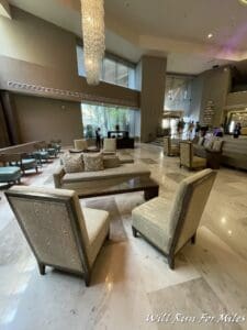 a large lobby with chairs and tables