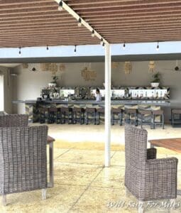 a patio with chairs and tables