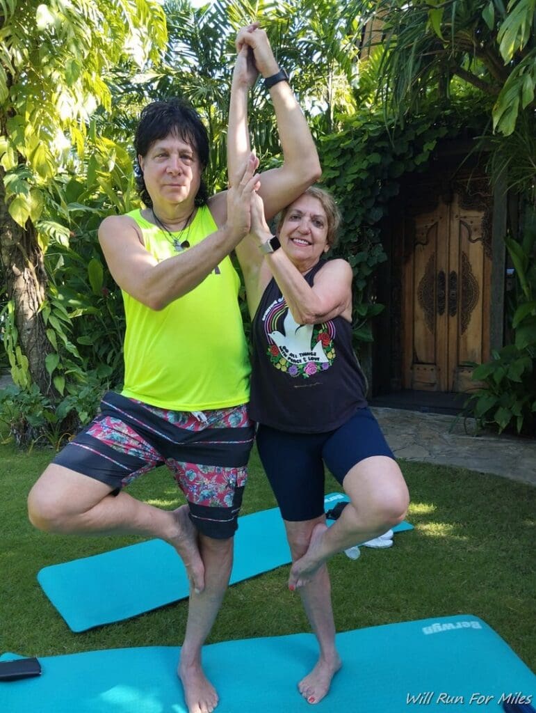 a man and woman doing yoga