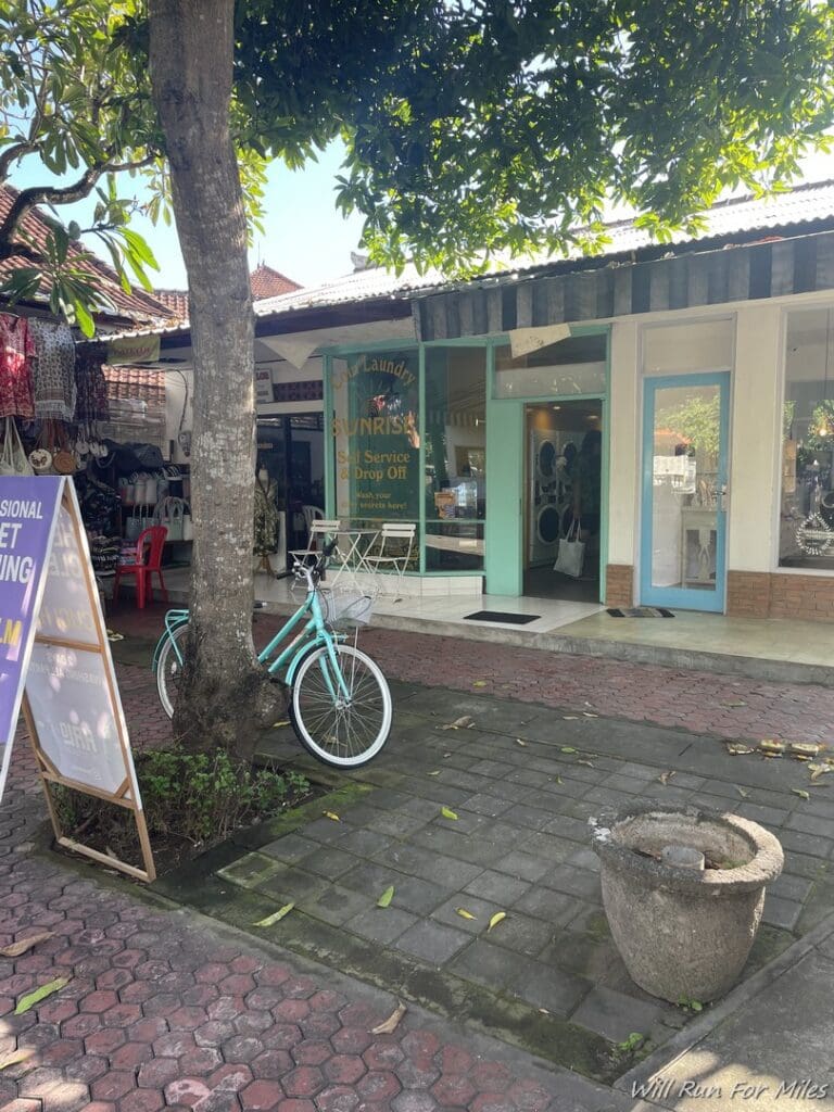 a bicycle parked in front of a store